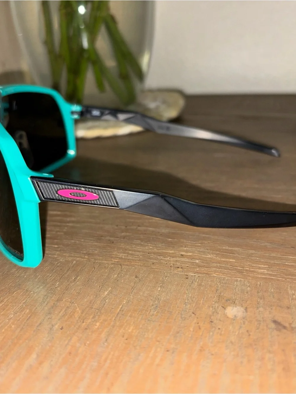 Woman teal Oakley sunglasses